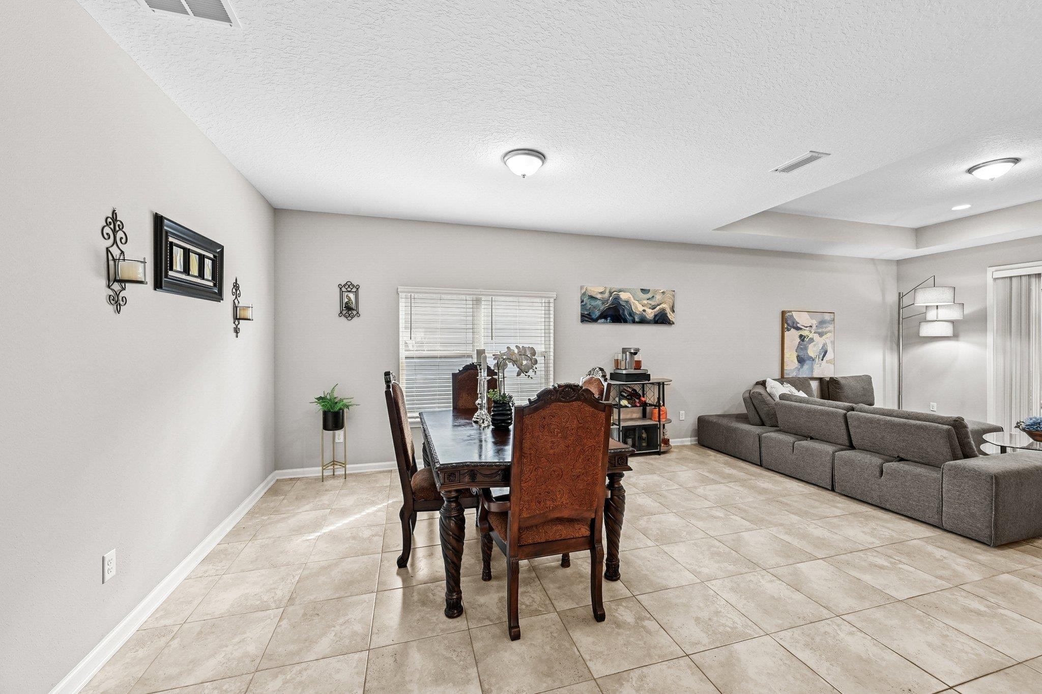 75 Pinzon Place St. Augustine, FL 32095 - Photo 8 of 51 a living room with furniture and a dining table with rug