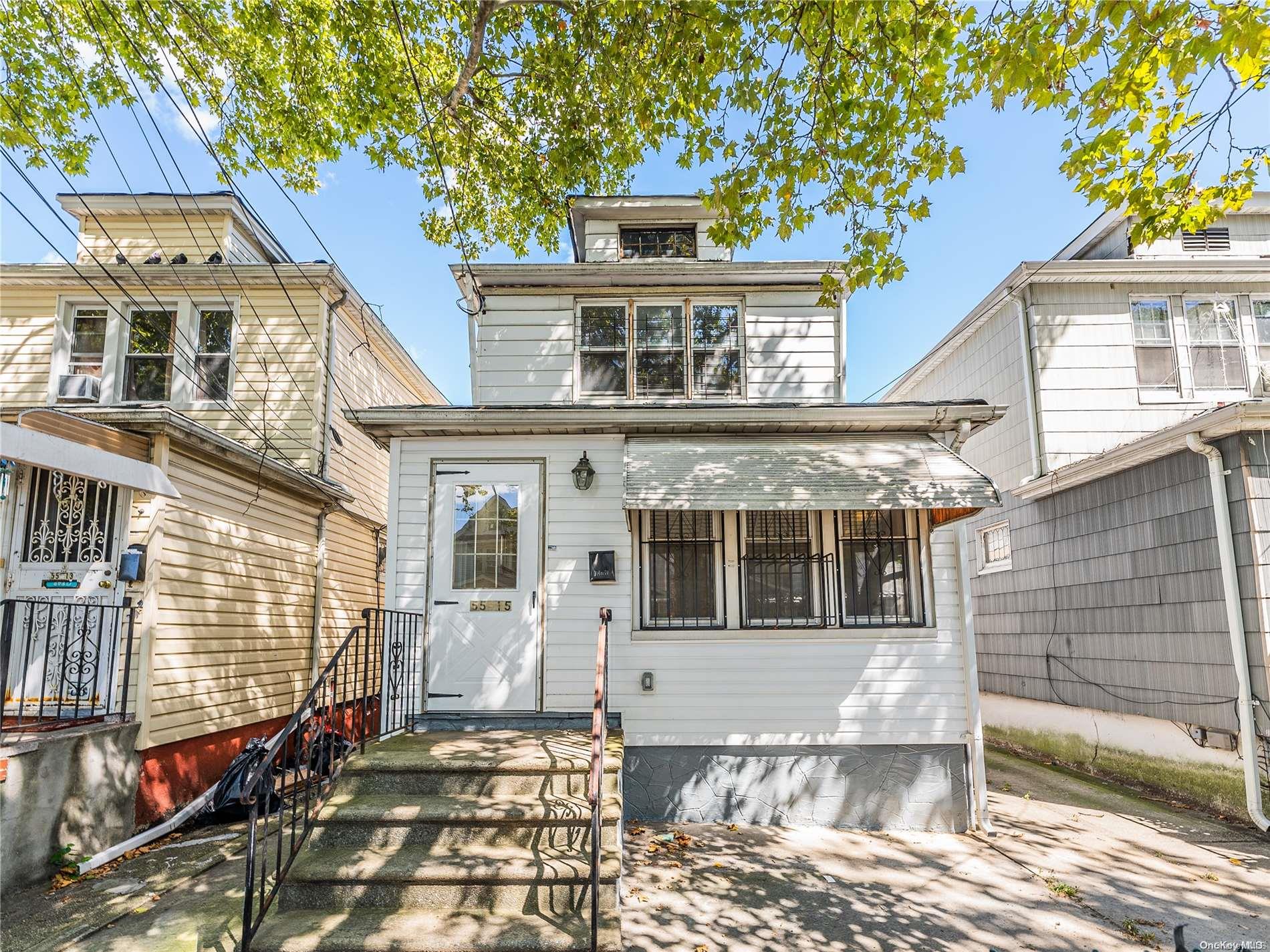 55-15 96th Street Queens, NY 11368 - Photo 2 of 31 a front view of a house with a large window