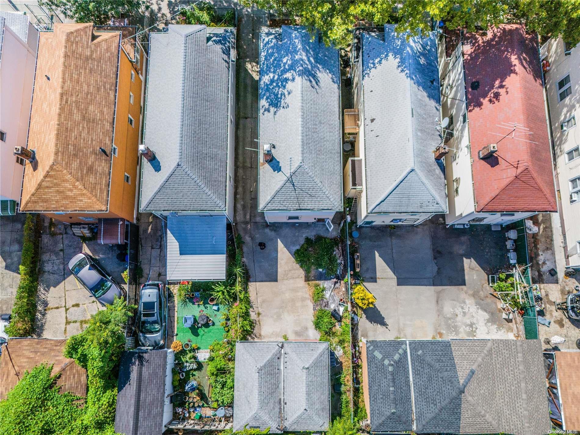 55-15 96th Street Queens, NY 11368 - Photo 4 of 31 an aerial view of multiple houses with outdoor space