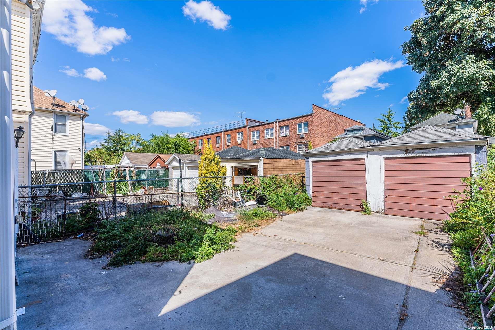 55-15 96th Street Queens, NY 11368 - Photo 6 of 31 a view of a house with a yard and potted plants