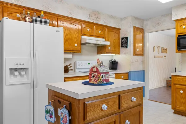 a kitchen with stainless steel appliances a refrigerator and a stove