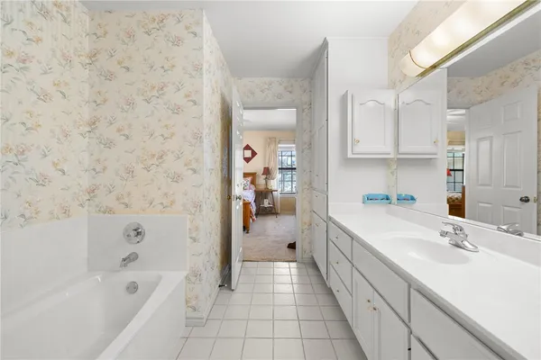 a bathroom with a toilet and a shower curtain