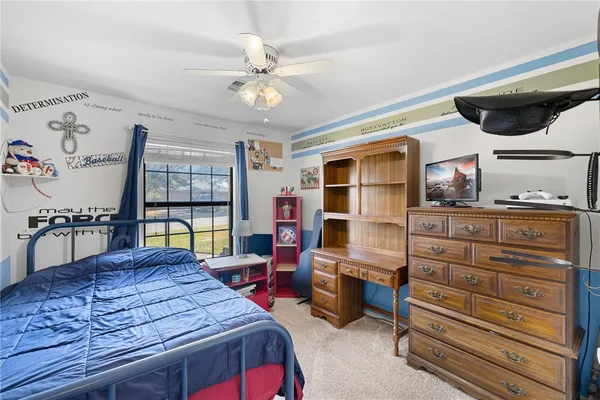 an aerial view of a houses with yard