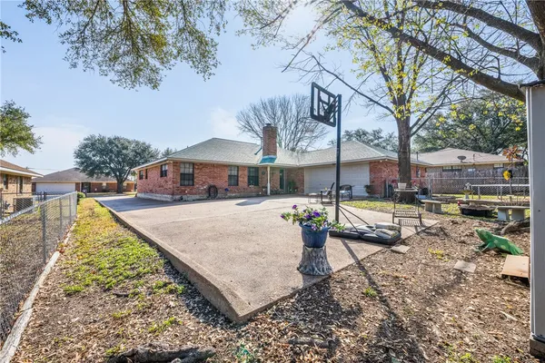 a view of a house with swimming pool and sitting area