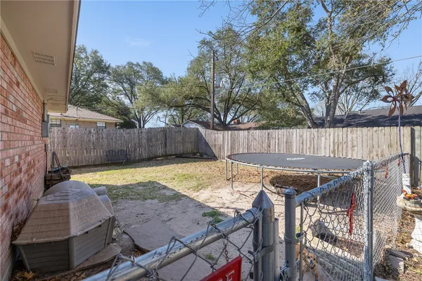 a view of a backyard with a fire pit and furniture