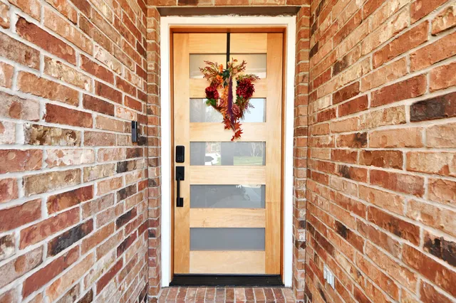 a aerial view of multi story residential apartment building with yard