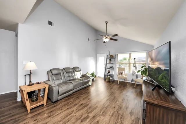 a spacious bathroom with a sink a mirror and a shower
