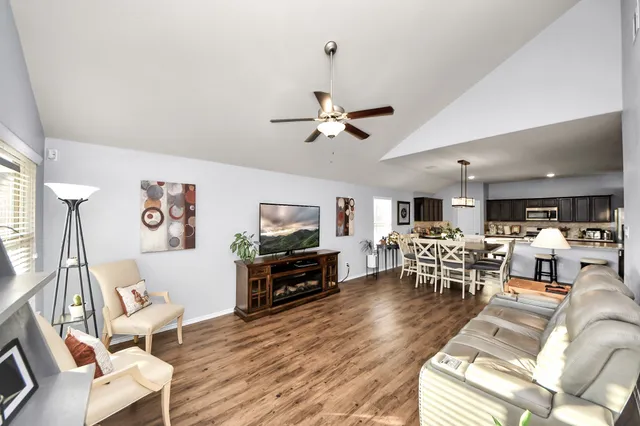 a room with furniture pool table and flat screen tv