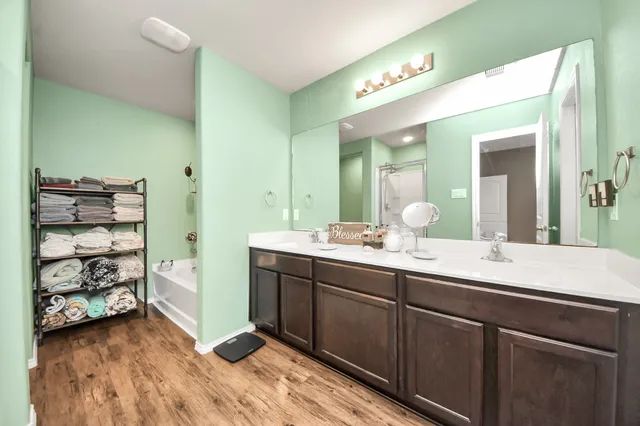 a view of backyard with deck and garden