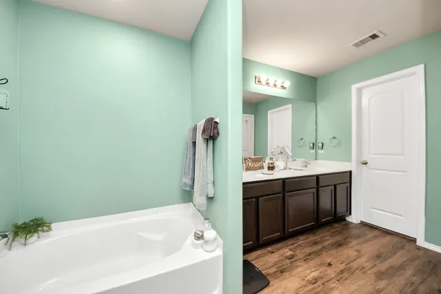 a building outdoor space with patio furniture and potted plants