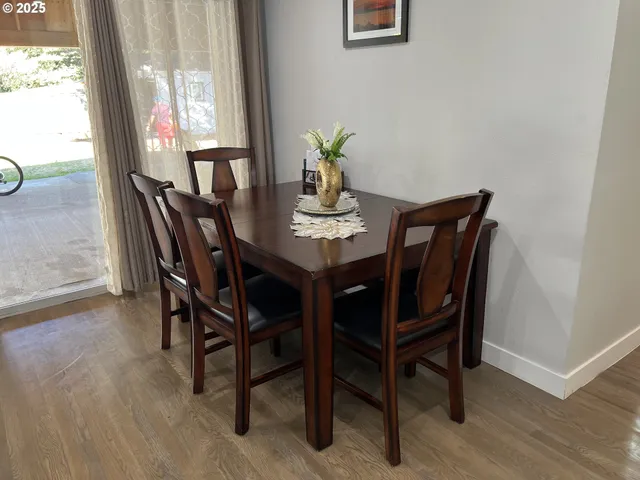 a view of a dining room with furniture window and outside view