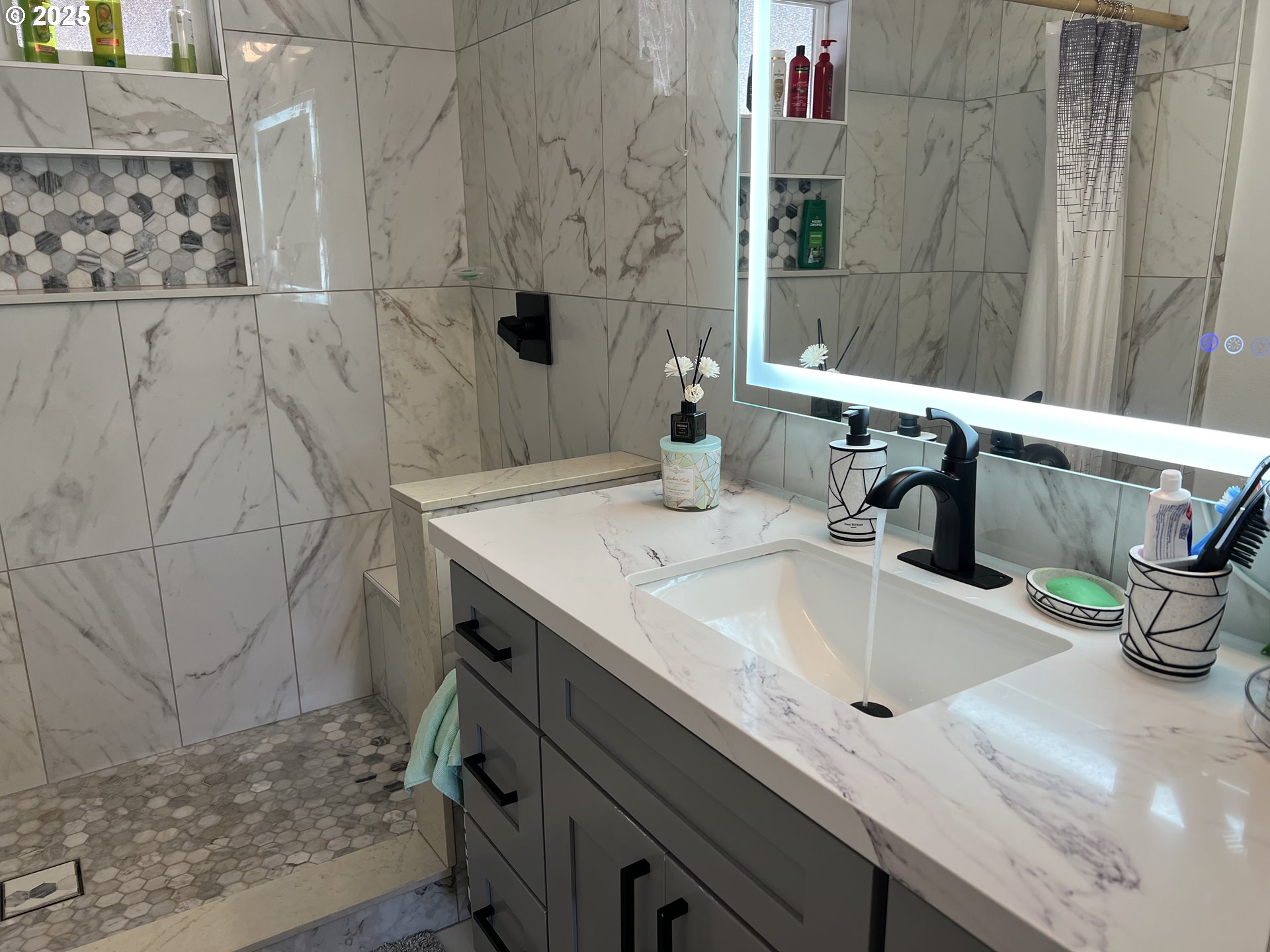 17519 Southeast Tibbetts Street Portland, OR 97236 - Photo 15 of 32 a bathroom with a sink and a mirror