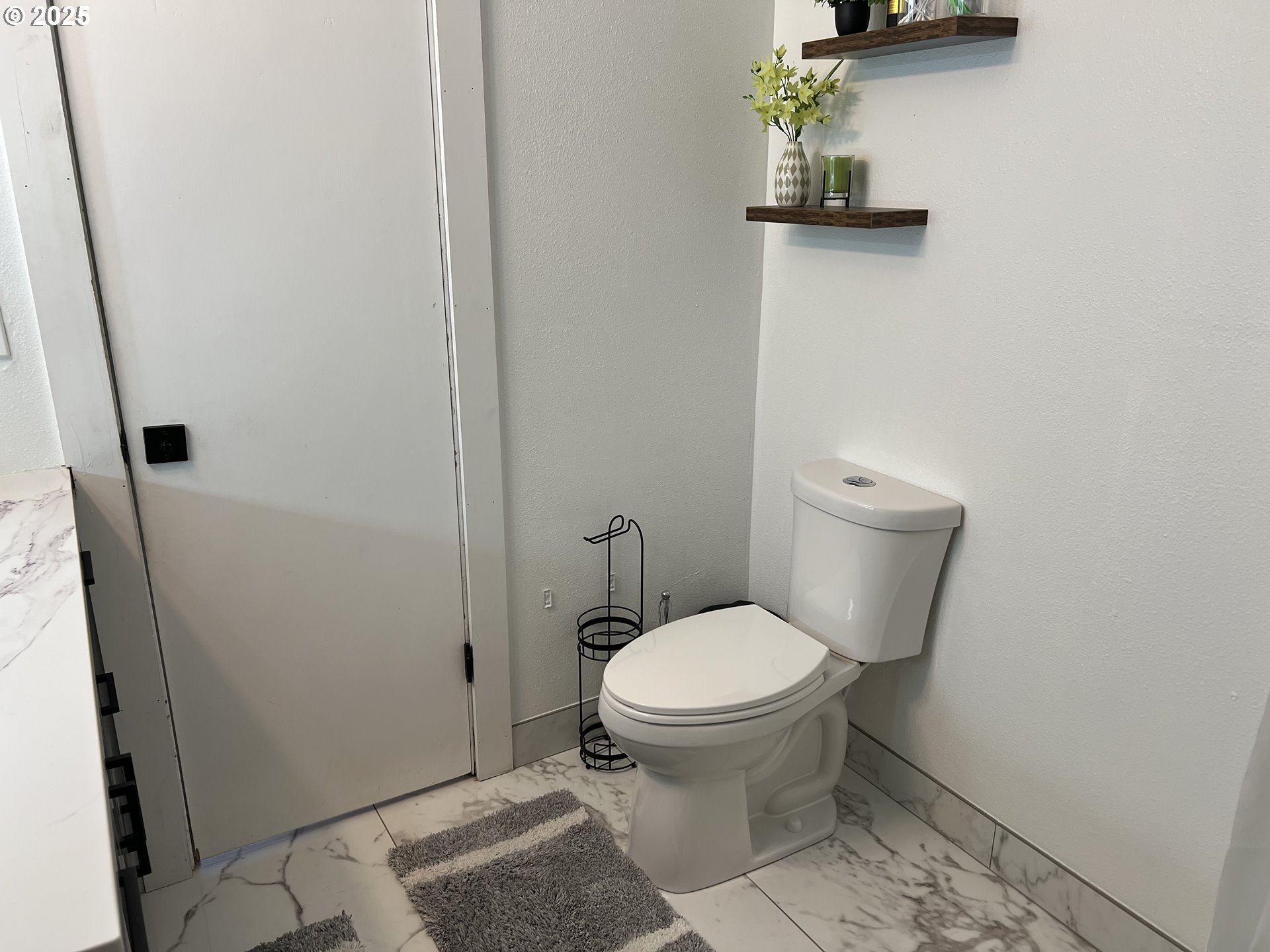 17519 Southeast Tibbetts Street Portland, OR 97236 - Photo 16 of 32 a bathroom with a toilet and a sink