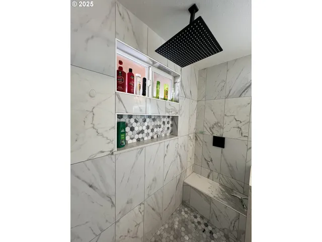 a bedroom with a bed and a lamp