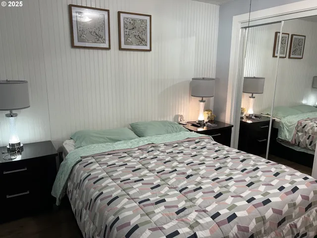 a bedroom with a bed and dresser