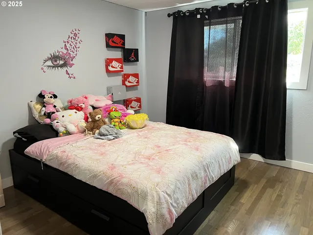 a bedroom with a bed and dresser