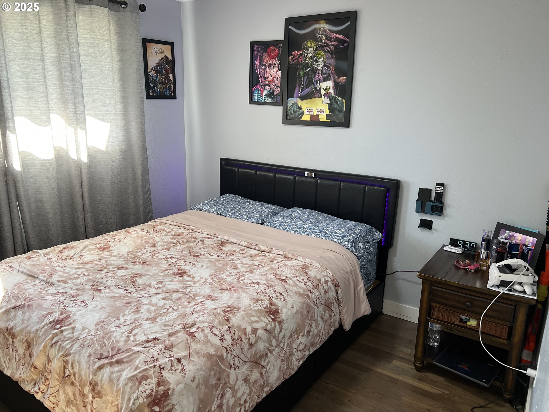 17519 Southeast Tibbetts Street Portland, OR 97236 - Photo 22 of 32 a bedroom with a bed and wooden floor
