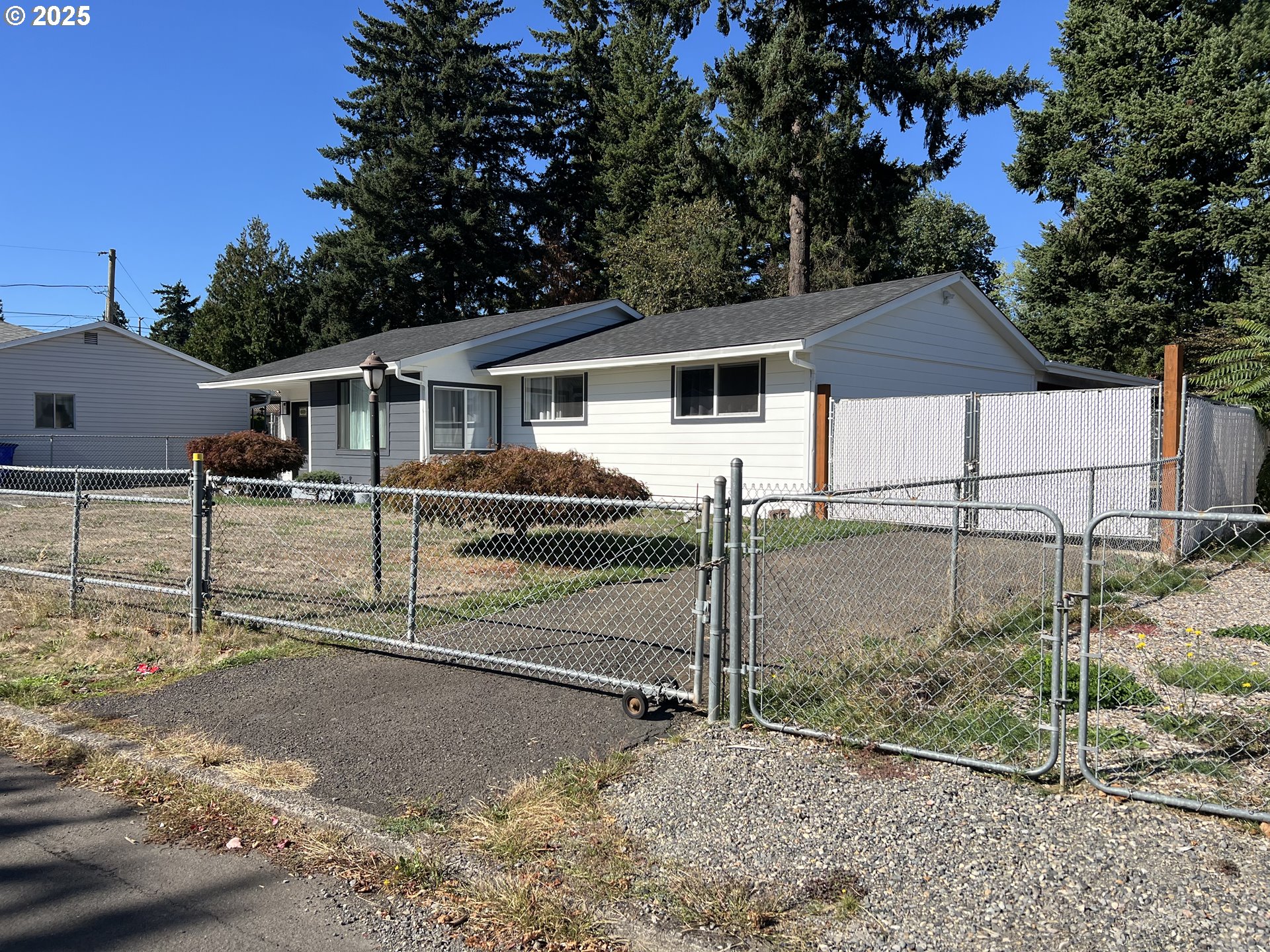 17519 Southeast Tibbetts Street Portland, OR 97236 - Photo 3 of 32 a view of a house with a backyard