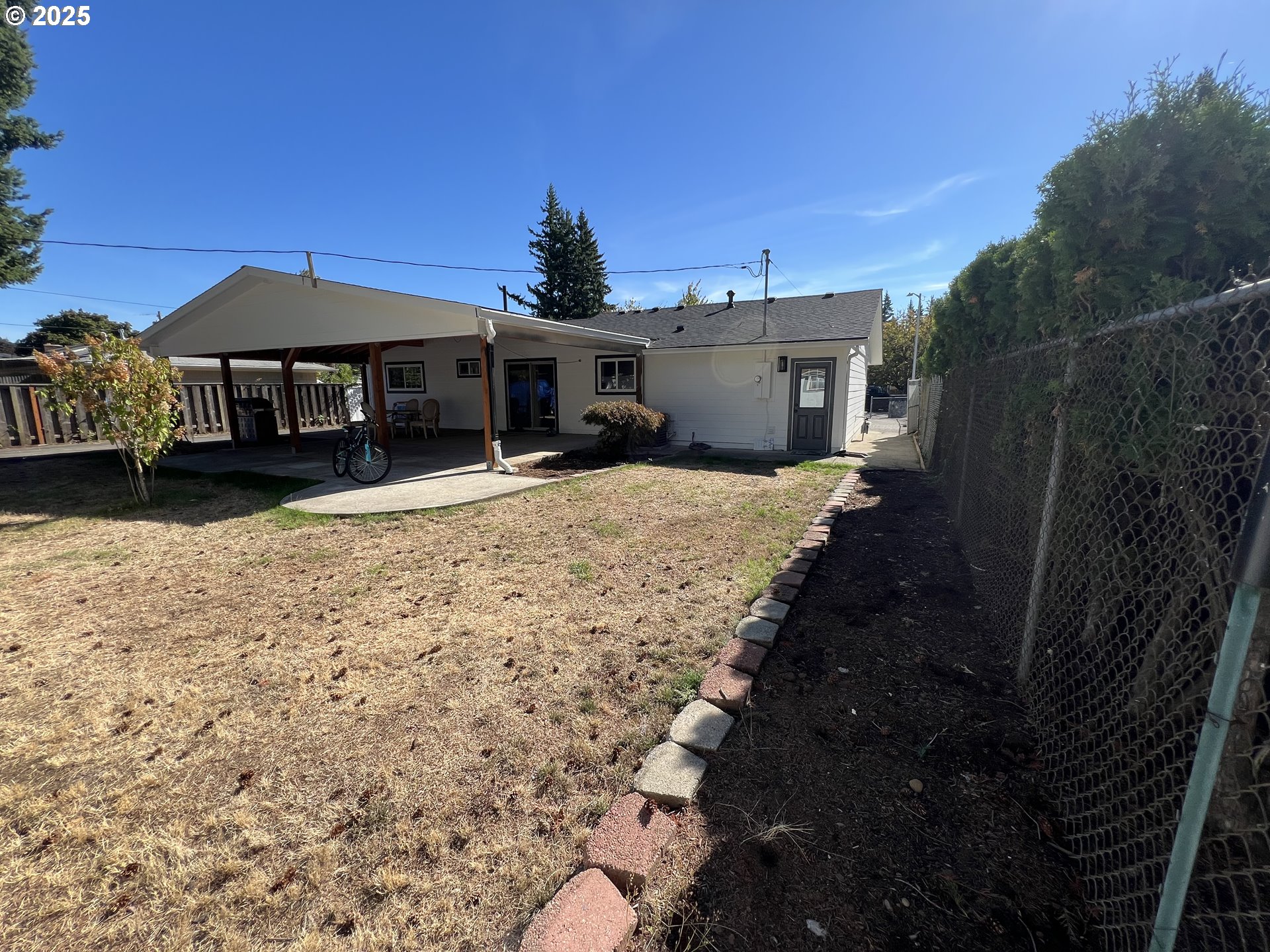 17519 Southeast Tibbetts Street Portland, OR 97236 - Photo 32 of 32 a view of a house with a yard