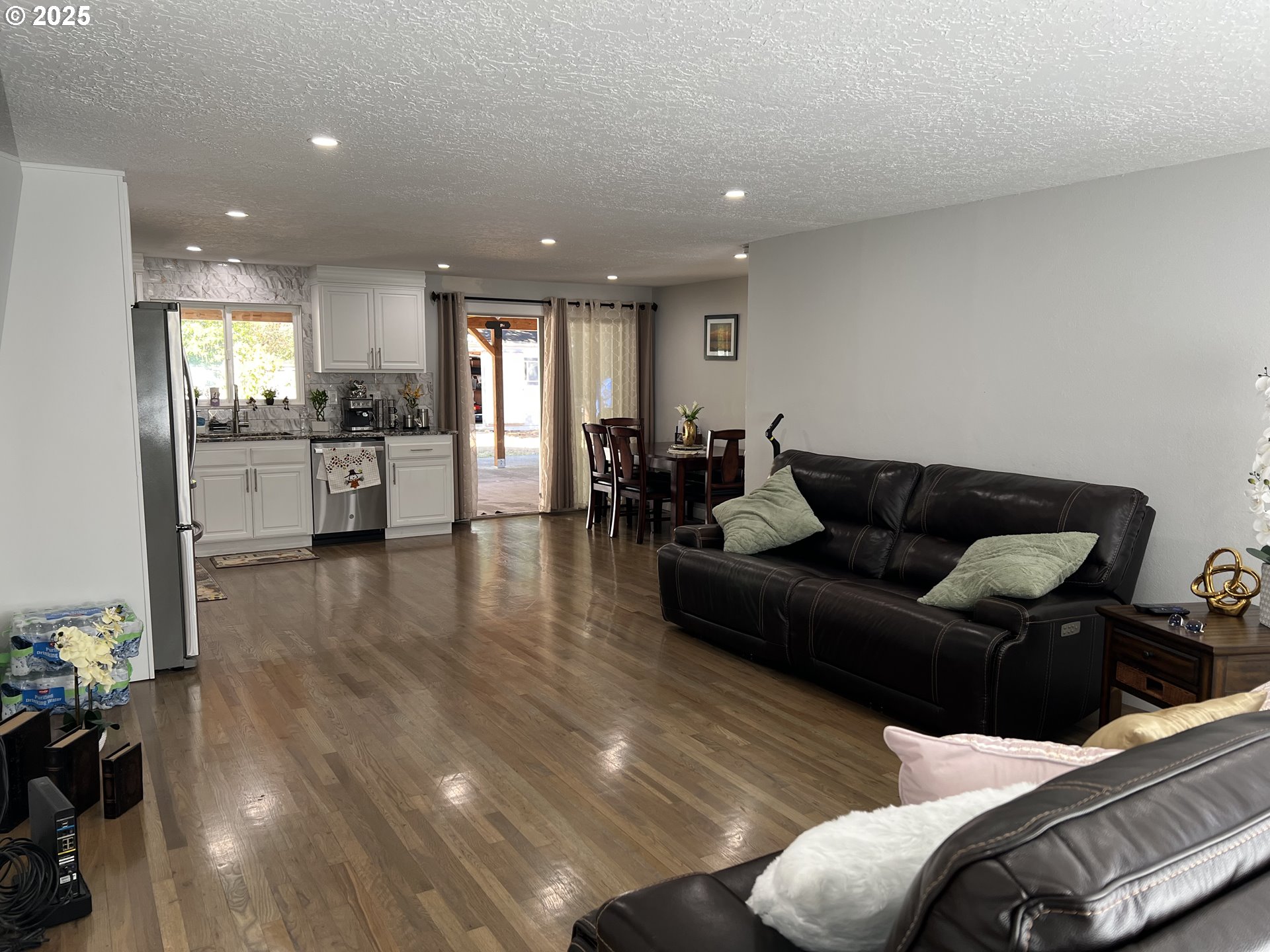 17519 Southeast Tibbetts Street Portland, OR 97236 - Photo 6 of 32 a living room with furniture and wooden floor