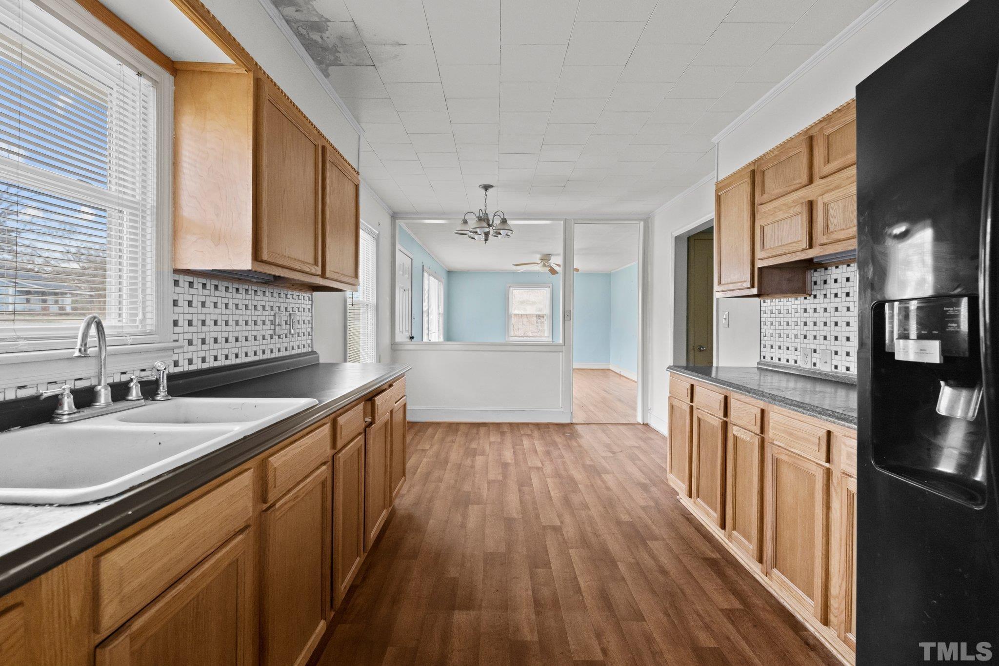 293 Cavel Chub Lake Road Roxboro, NC 27574 - Photo 6 of 15 a kitchen with stainless steel appliances granite countertop a sink stove and refrigerator