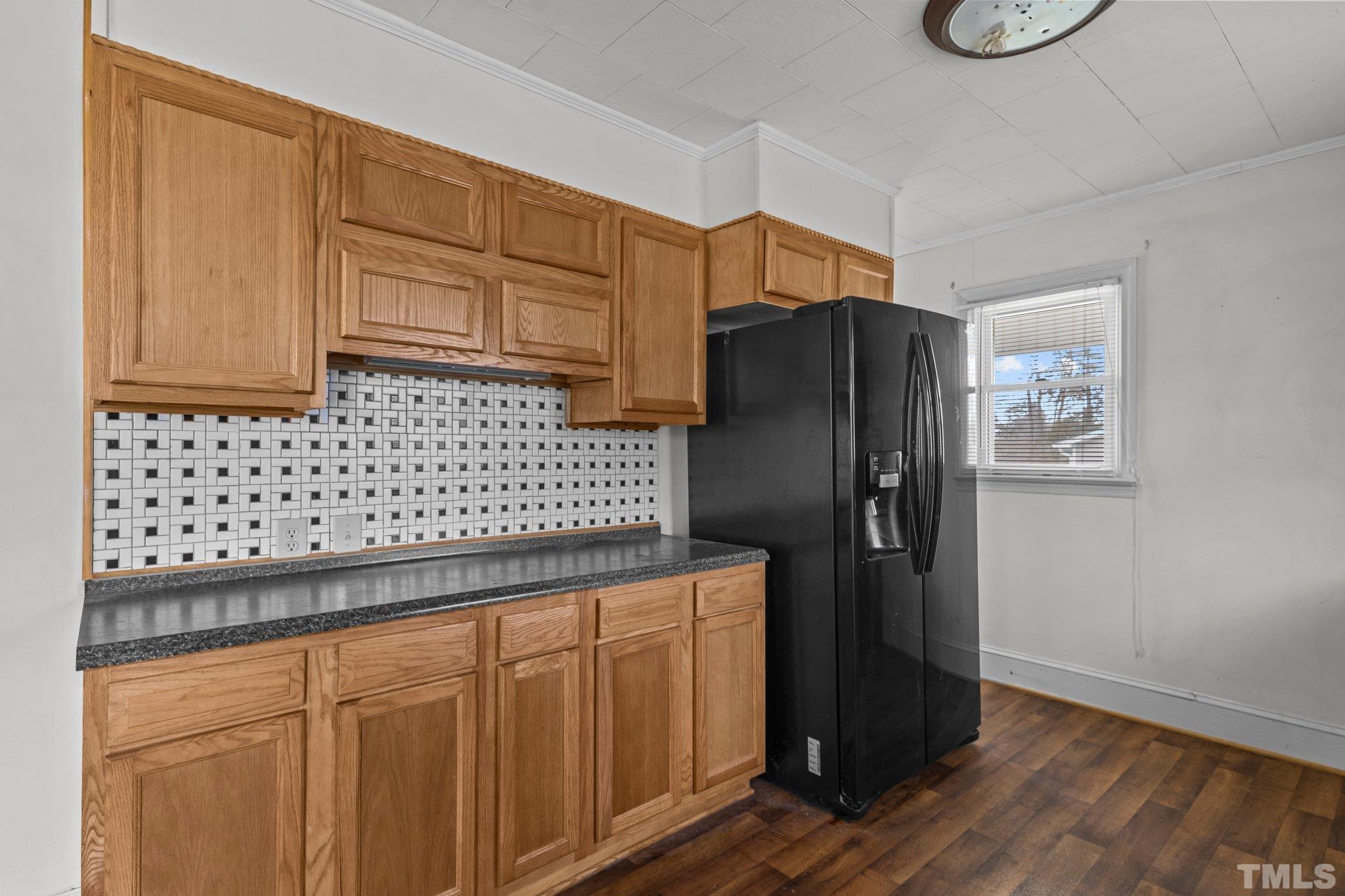 293 Cavel Chub Lake Road Roxboro, NC 27574 - Photo 8 of 15 a kitchen with granite countertop cabinets and refrigerator