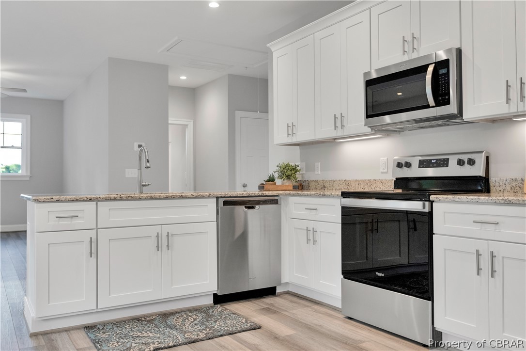 7395 Sinclair Way Gloucester, VA 23061 - Photo 2 of 12 Beautiful kitchen with granite counters, shaker cabinets, stainless steel appliances, and undercabinet lighting- similar construction