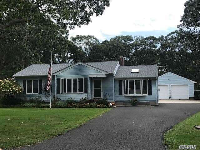 32 Wakeman Road Hampton Bays, NY 11946 - Photo 1 of 1 front view of a house with a yard