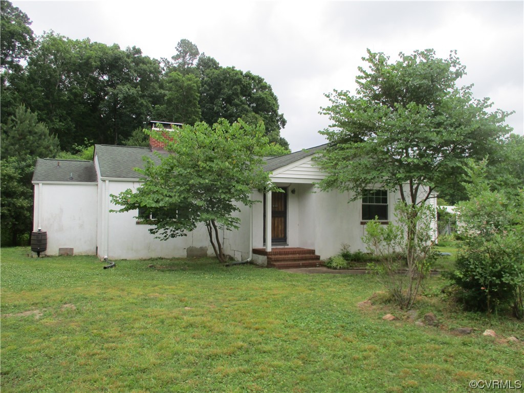 2409 Burgess Road Chester, VA 23836 - Photo 1 of 50 a view of a house with backyard and garden