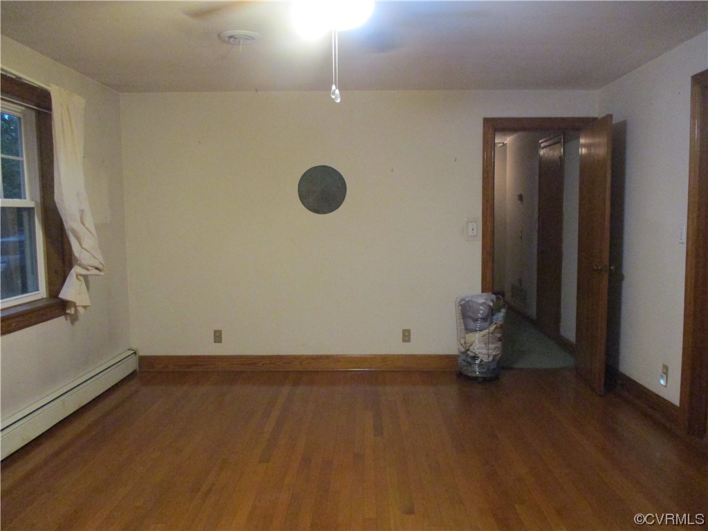 2409 Burgess Road Chester, VA 23836 - Photo 14 of 50 a view of room with wooden floor