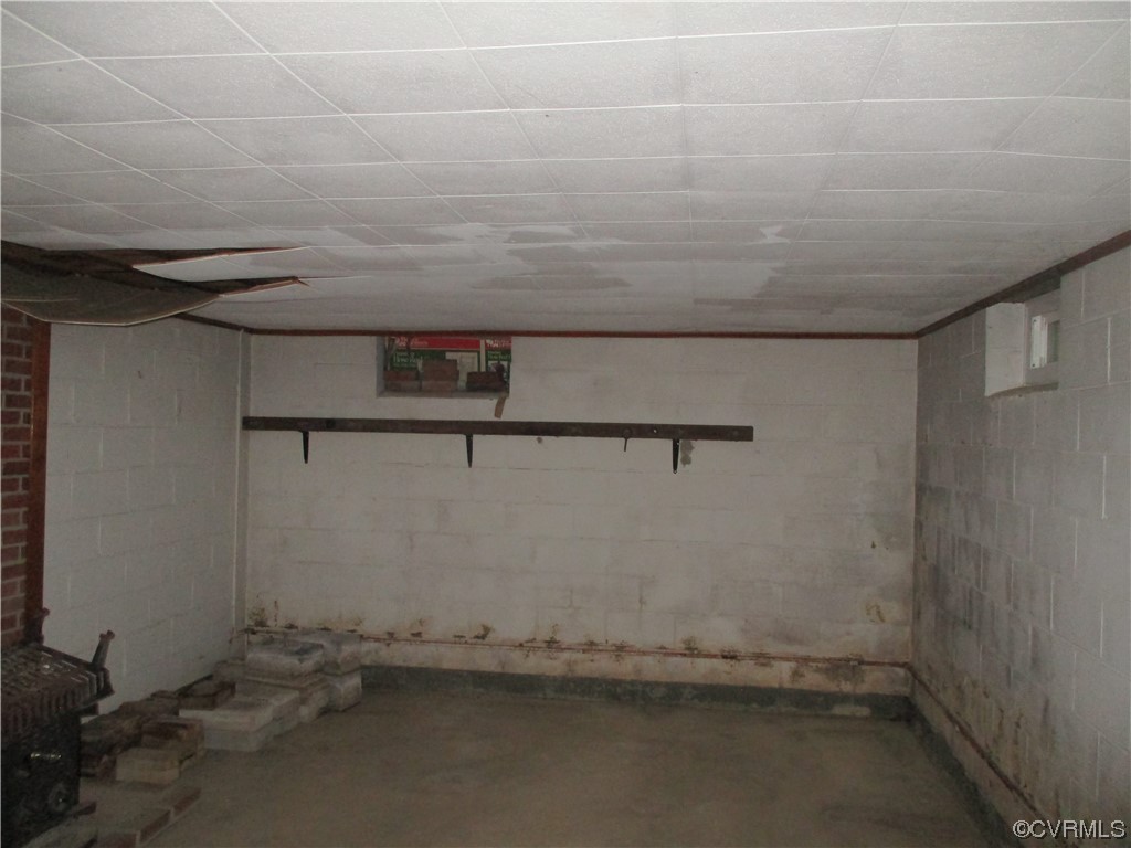 2409 Burgess Road Chester, VA 23836 - Photo 25 of 50 a room with water heater and a cabinet