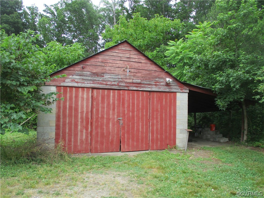 2409 Burgess Road Chester, VA 23836 - Photo 7 of 50 a backyard of a house with lots of green space
