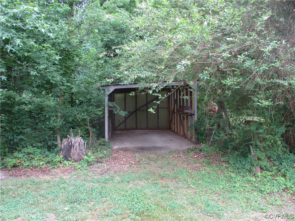 2409 Burgess Road Chester, VA 23836 - Photo 8 of 50 a backyard of a house with lots of green space