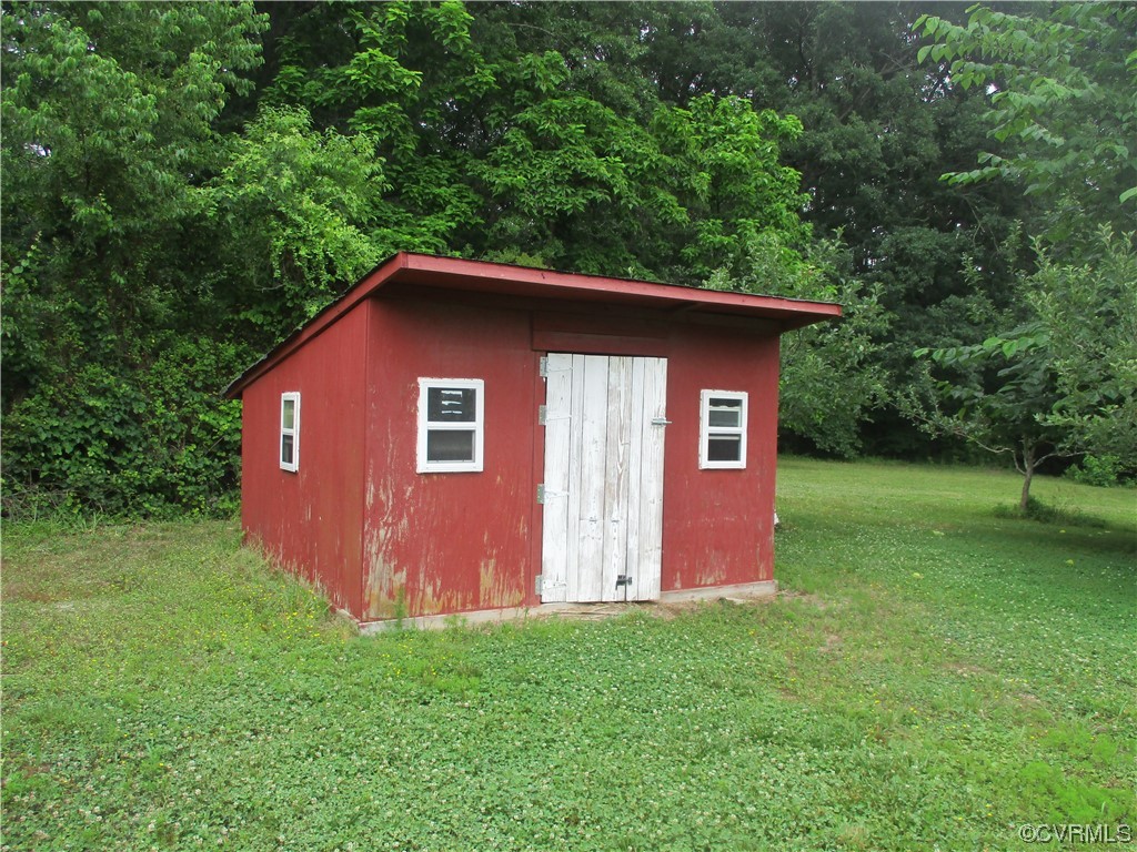 2409 Burgess Road Chester, VA 23836 - Photo 10 of 50 a view of a backyard with barn