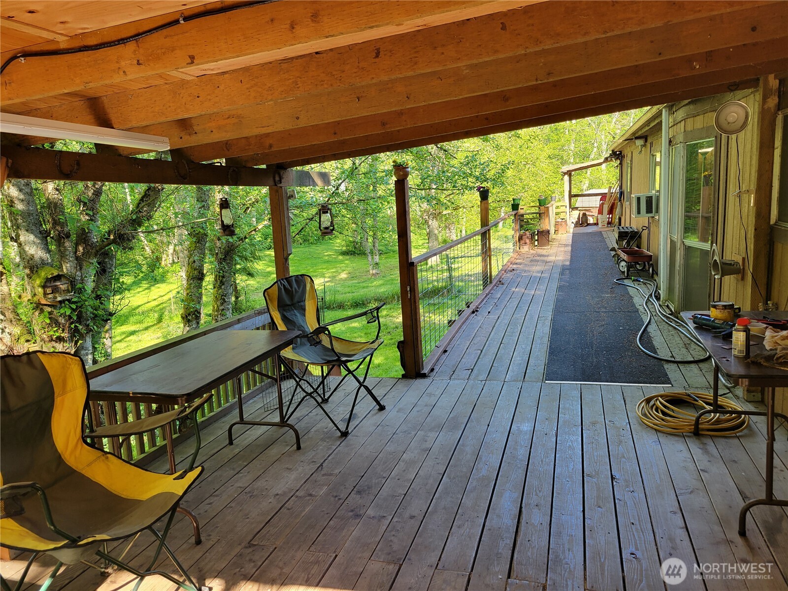3824 Birch Bay Lynden Road Custer, WA 98240 - Photo 13 of 23 a view of a chairs and table in patio with wooden floor