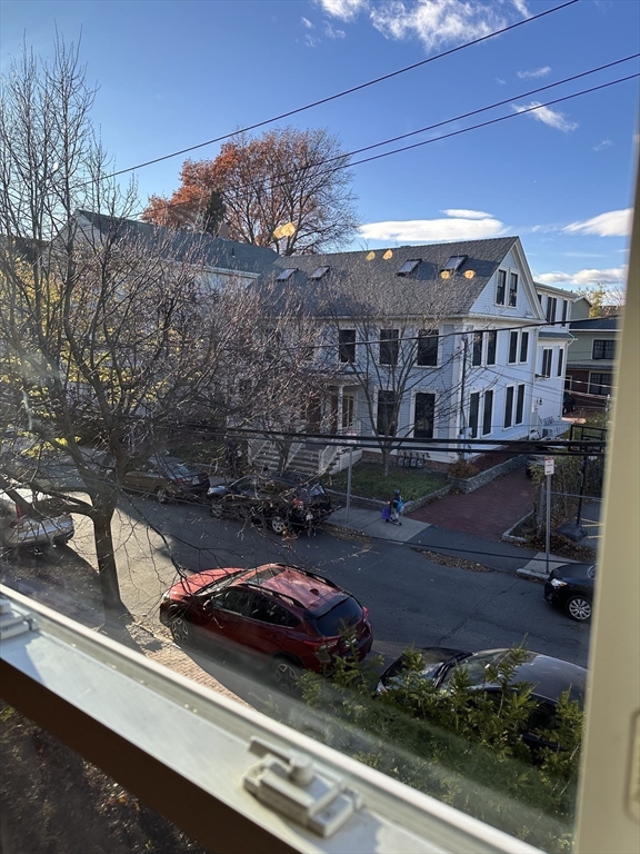 18 Tremont Street, Unit 2 Cambridge, MA 02139 - Photo 14 of 14 a view of a patio with table and chairs and potted plants