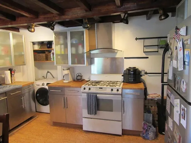 a kitchen with a stove and a sink