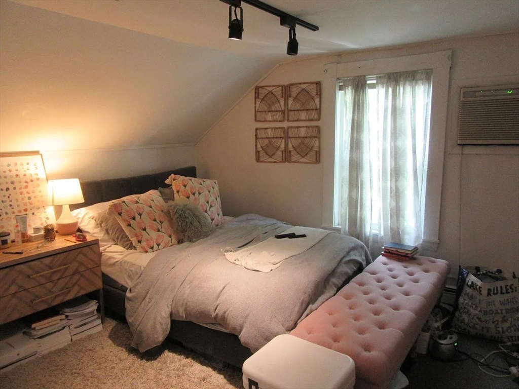 18 Tremont Street, Unit 2 Cambridge, MA 02139 - Photo 10 of 14 a bedroom with bed and window