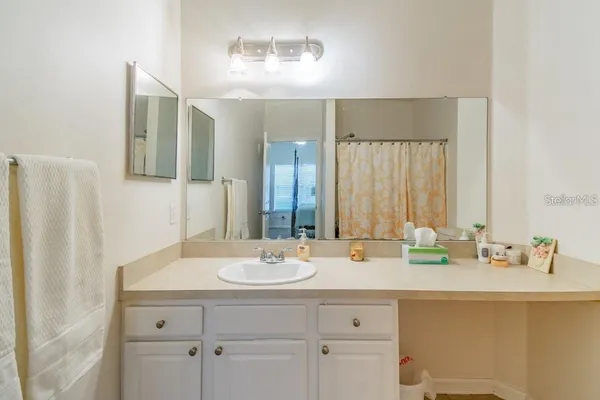 a bathroom with a sink and a mirror