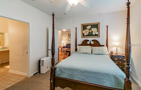 a bedroom with a bed and dresser