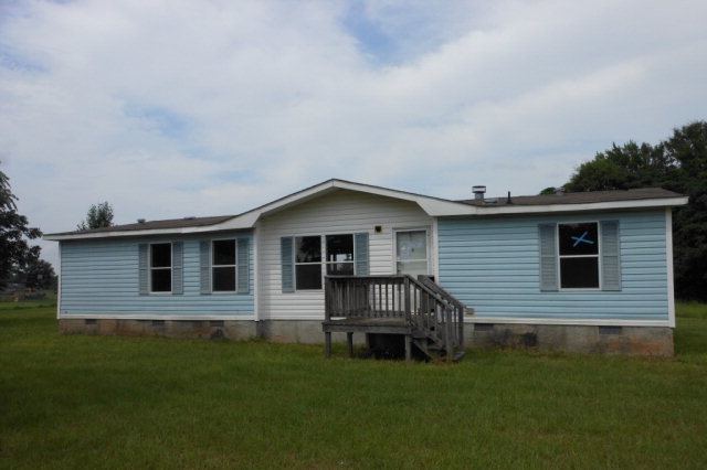 401 Big 6 Farms Road Fort Valley, GA 31030 - Photo 1 of 1 a view of a house with a yard