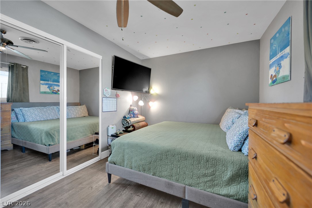 2221 Englestad Street North Las Vegas, NV 89030 - Photo 17 of 32 Relax in this comfortable bedroom featuring convenient mirrored closet doors.