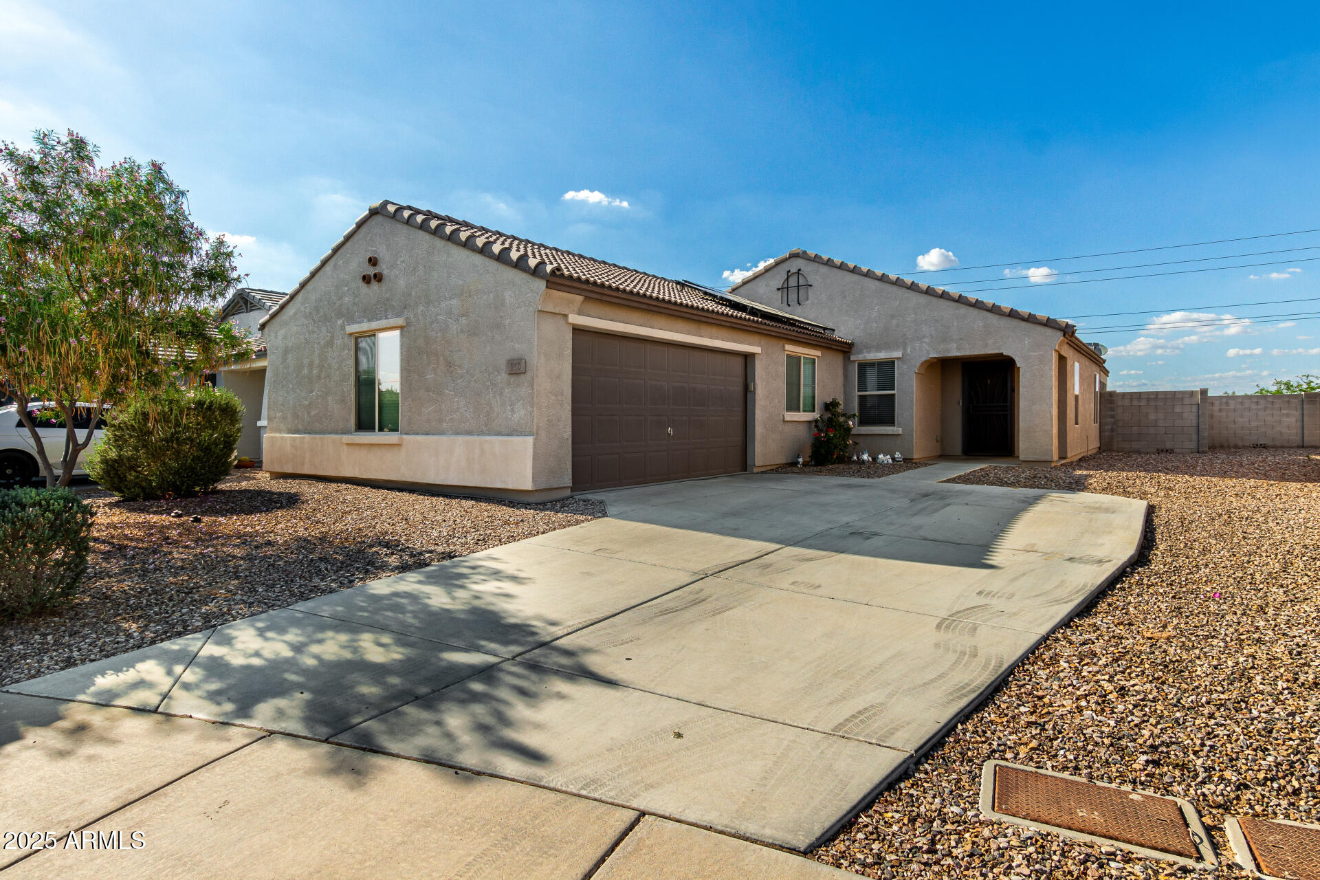 910 Prior Avenue Coolidge, AZ 85128 - Photo 2 of 22 a front view of a house with a yard