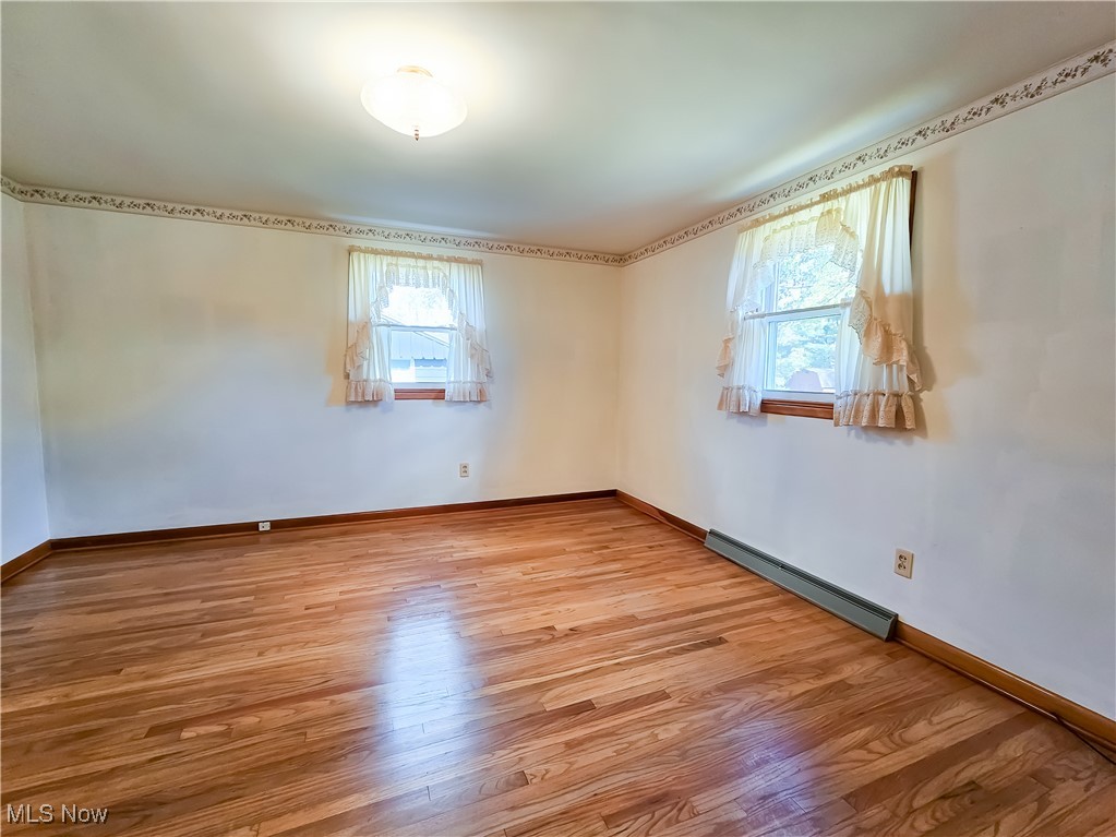 6040 Firestone Road Northeast Canton, OH 44721 - Photo 10 of 26 Bedroom 2 - Hardwood Flooring