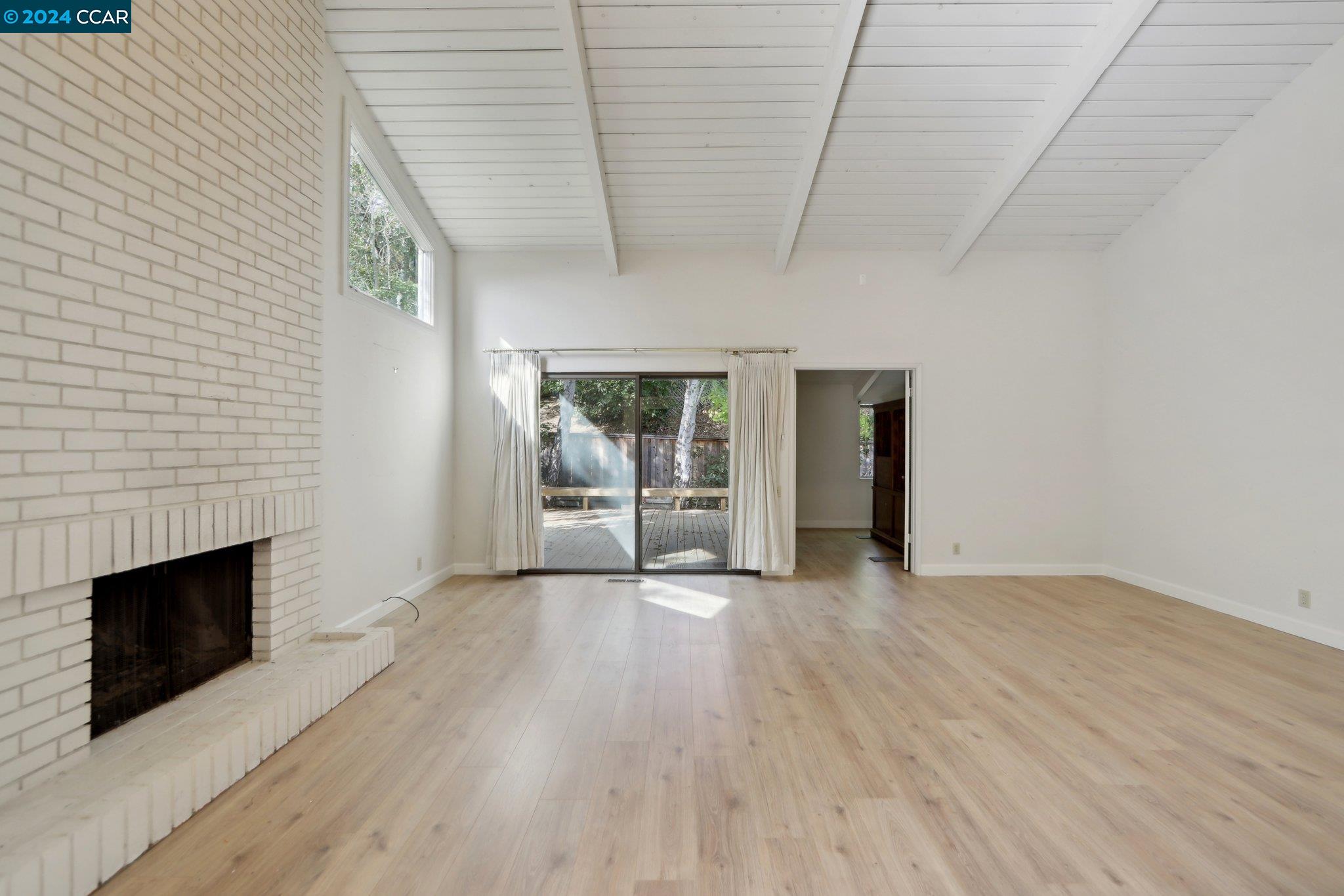 826 Augusta Drive Moraga, CA 94556 - Photo 11 of 35 a view of empty room with wooden floor and fireplace