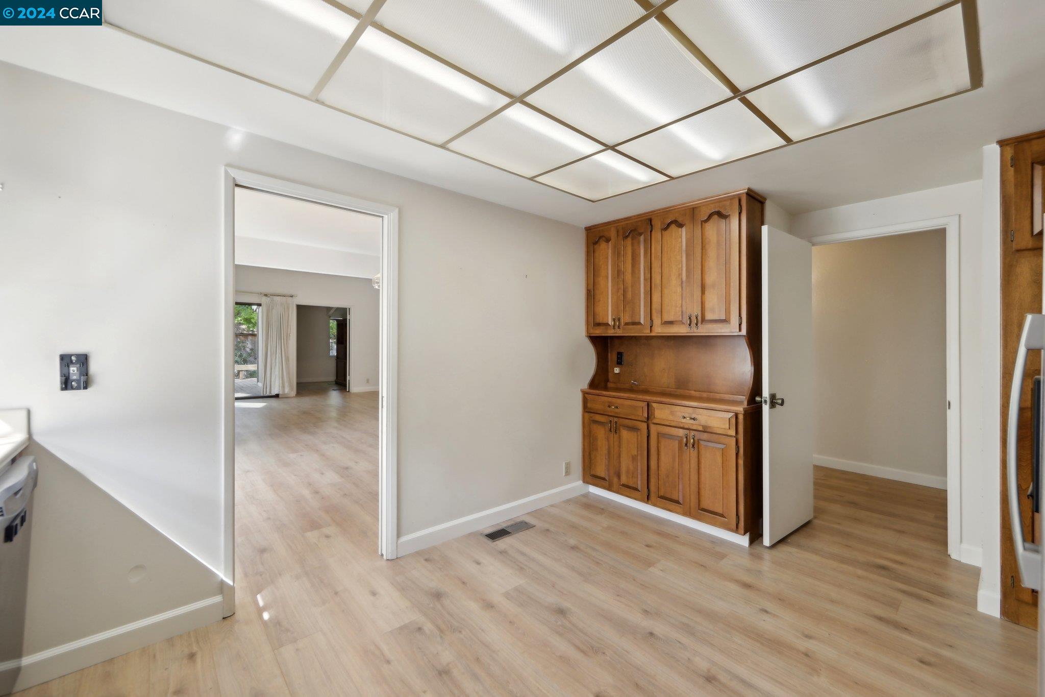 826 Augusta Drive Moraga, CA 94556 - Photo 15 of 35 a view of a kitchen with a sink and dishwasher with wooden floor