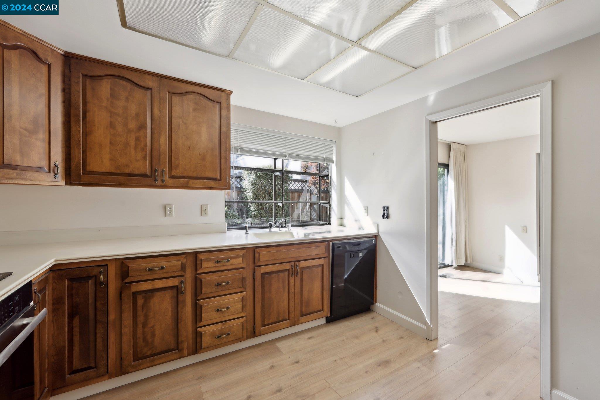 826 Augusta Drive Moraga, CA 94556 - Photo 16 of 35 a kitchen with wooden cabinets and sink
