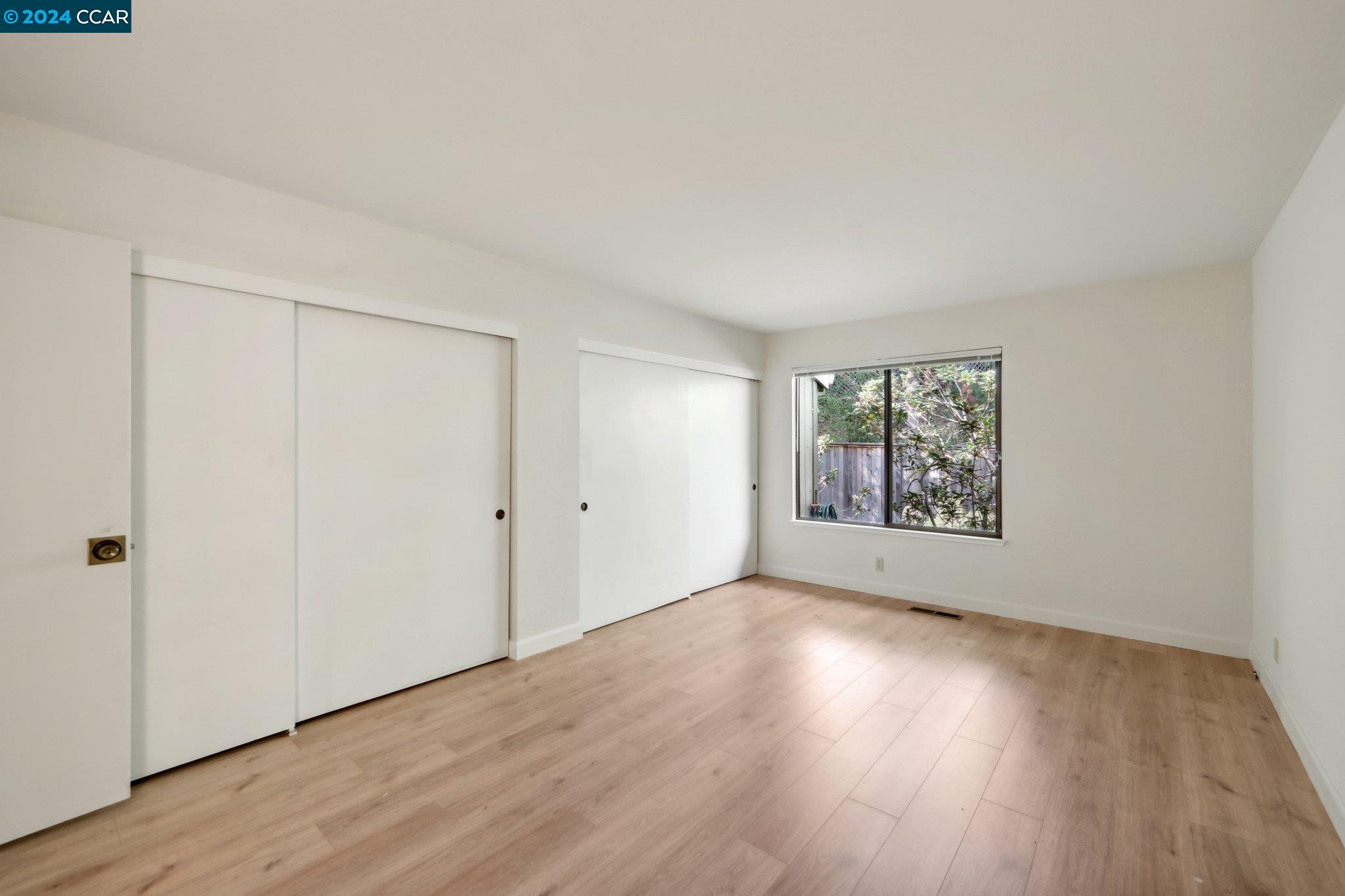 826 Augusta Drive Moraga, CA 94556 - Photo 20 of 35 a view of an empty room with wooden floor and a window
