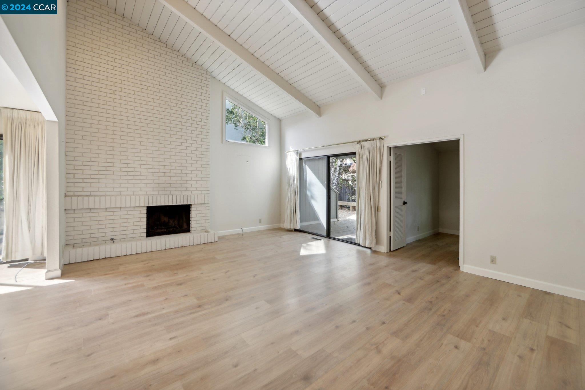 826 Augusta Drive Moraga, CA 94556 - Photo 5 of 35 a view of an empty room with a fireplace and a window