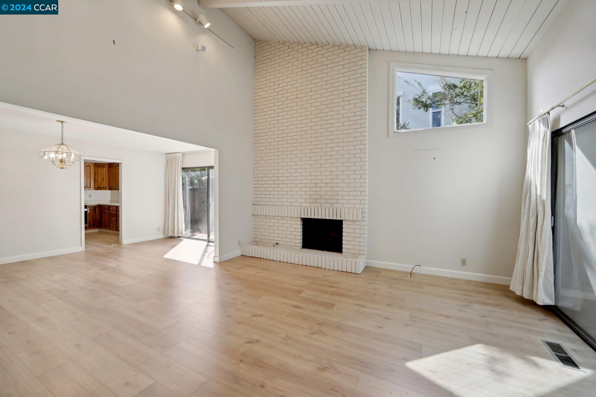 826 Augusta Drive Moraga, CA 94556 - Photo 9 of 35 a view of an empty room with wooden floor and a window